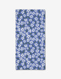 The Hufton Studio Sweetie Floral bar towel, made from eco-friendly Geoweave fabric, features a rectangular blue design with small white flowers and green leaves, shown flat on a white background.