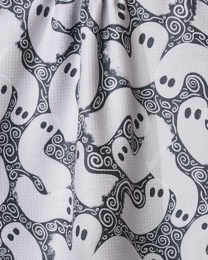 The Geometry Swirling Ghosts tea towel features cartoon ghosts and swirling designs, made from ultra-absorbent recycled materials—perfect for a playful kitchen touch.