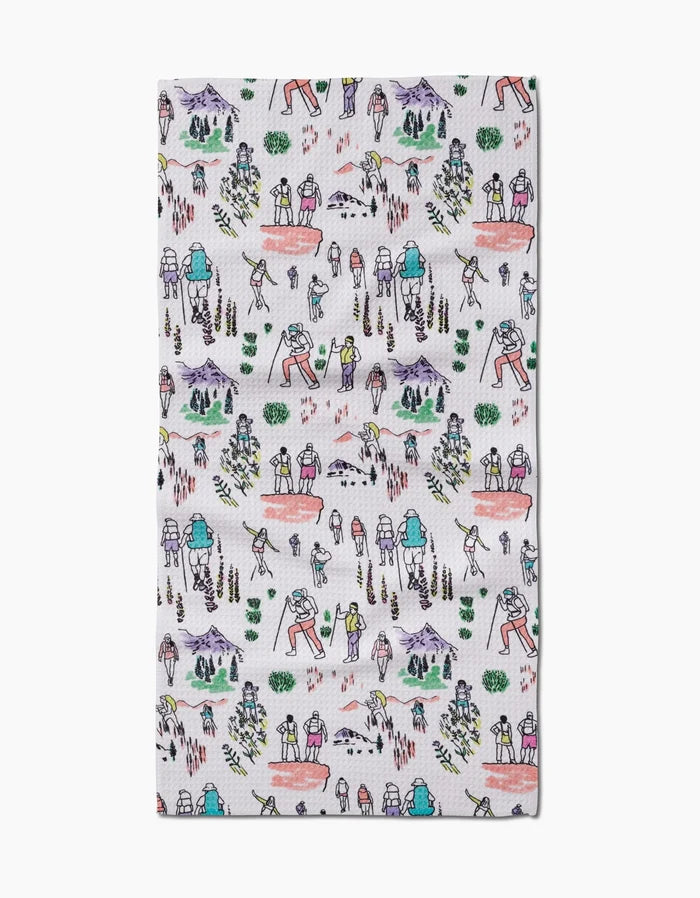 The Elisabeth Wing Take A Hike Bar Towel features a playful hand-drawn pattern of hikers, trees, mountains, and streams on ultra-absorbent Geoweave fabric.