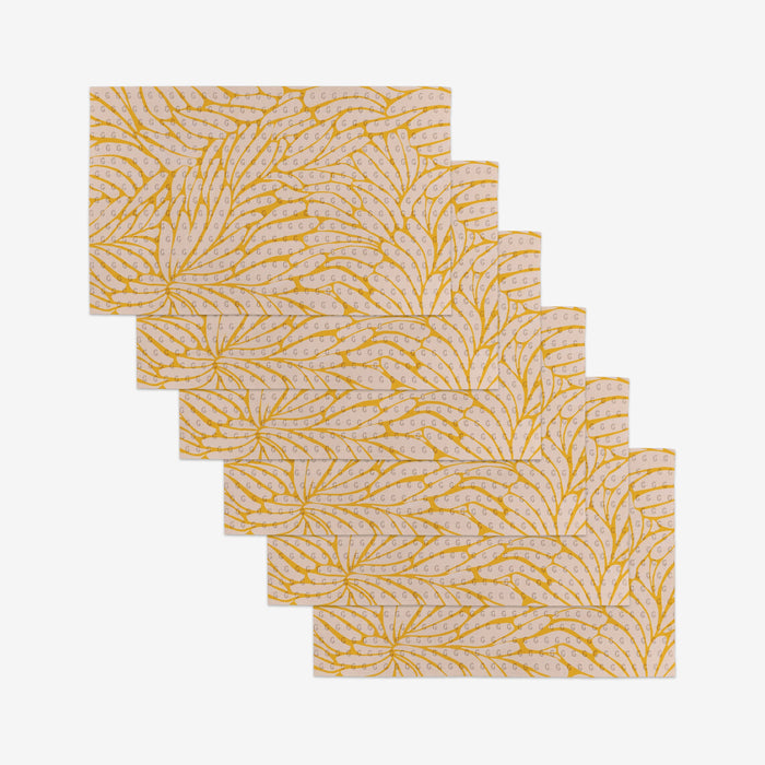 Six reusable rectangular pieces from GEOMETRY’s Tenderhearted collection, featuring a yellow leaf design on a light background, are arranged in a staggered overlap—an eco-friendly Not Paper Towel alternative.