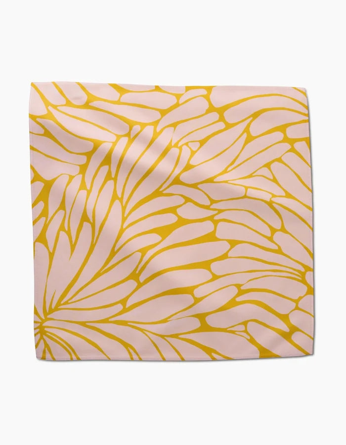 Tenderhearted by GEOMETRY is a square Geosuede scarf featuring a pink background with an abstract yellow floral pattern, soft folds, smooth texture, and an eco-friendly design.