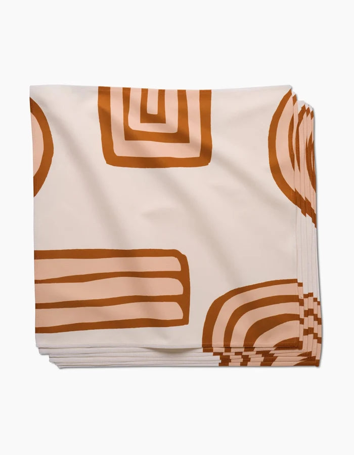 Terracotta Vibes by GEOMETRY: absorbent cloth dinner napkins with a cream background and bold, rust-orange geometric patterns—functional and stylish for any table.