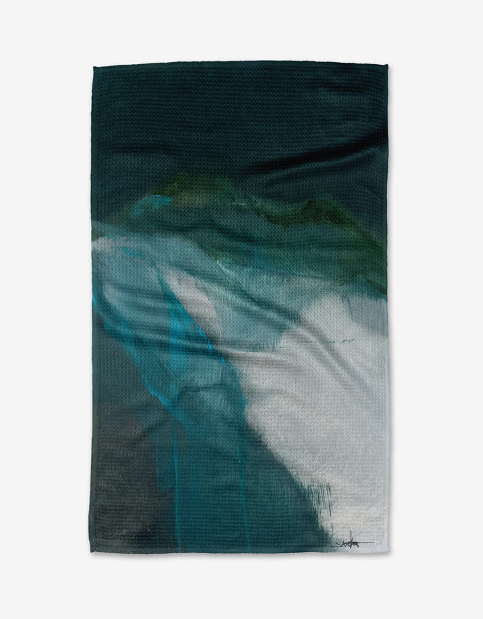 The Air We Breathe tea towel by Jennifer Janesko features a textured Geoweave™ fabric and an abstract mountain-inspired design in dark green, teal, and white tones.