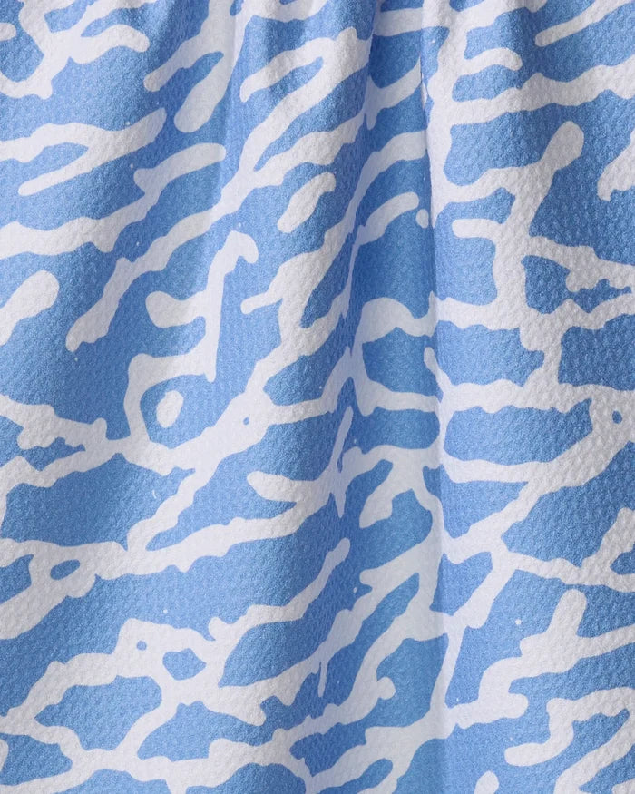 Close-up of Sissy Moon’s Tinker kitchen towel, crafted from recycled materials with a light blue backdrop and an abstract white wavy pattern reminiscent of zebra or coral designs.