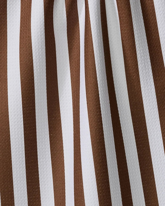 Close-up of the Toni Stripe tea towel by Kailee Wright, showcasing vertical brown and white stripes on textured, quick-drying fabric made from recycled materials.