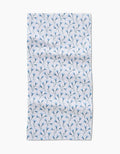 The Trailing Flowers in Blue Bar Towel by Teri the Butter features small blue floral branches evenly spaced on white Geoweave fabric, with visible edges and a slightly wrinkled appearance.