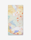 The Tree House bar towel by Kristina Baker features pastel abstract line drawings in orange, yellow, blue, and green on white, crafted from durable Geoweave fabric.