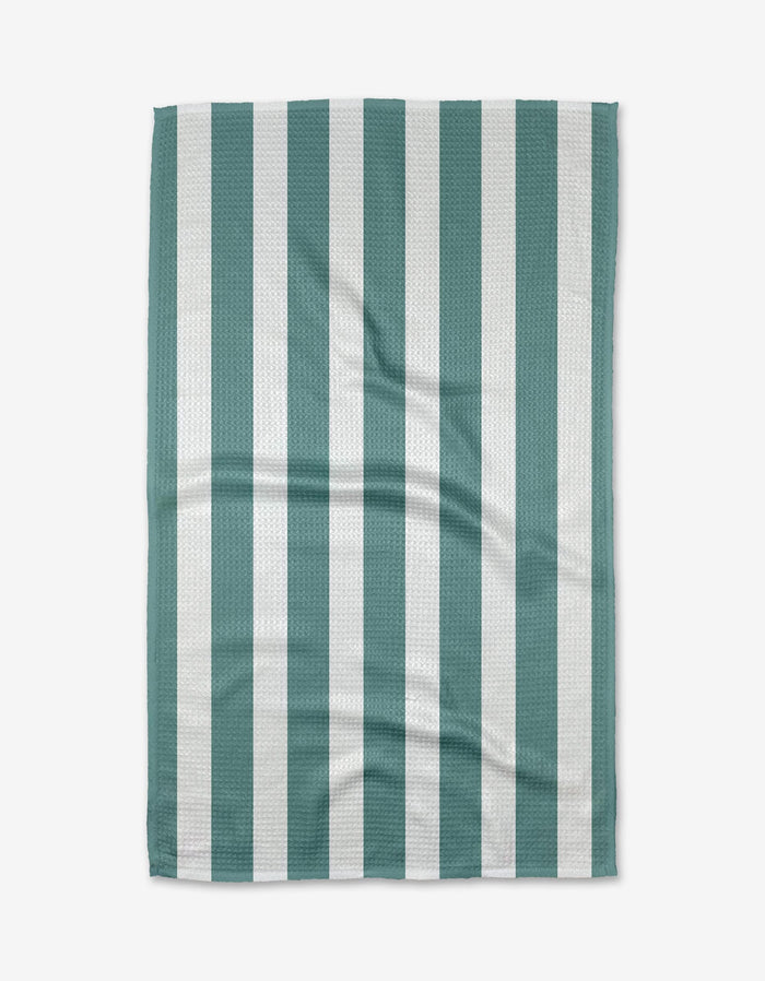 The BetterDays Trim Tea Towel is rectangular with alternating vertical stripes of teal green and white. Displayed flat on a white background, it has a subtle waffle texture, visible creases, and is made from post-consumer recycled materials.