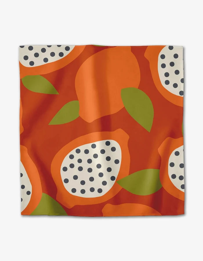 The Tropical Fruit square scarf by Lizzie Clark is made from recycled materials and showcases a bold abstract fruit print in orange, green, and cream with black dots and leaf motifs on a white background.