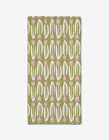 Kayla Anns Tulip Tango Bar Towel is rectangular, made from recycled materials, and features a playful modern pattern of white curved lines and pink tulip-like shapes in vertical rows on a solid green background.