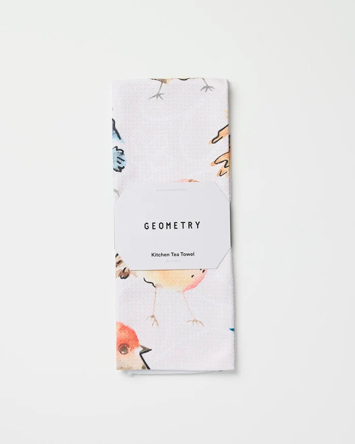 A white, absorbent kitchen towel featuring watercolor bird illustrations, called "Tweet Tweet" by Sara Mari, is neatly folded with its label shown against a plain white background.