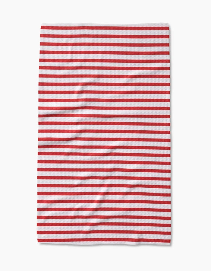 The Mindfulnice USA Stripes tea towel features evenly spaced horizontal red and white stripes on Geoweave fabric. Laid flat with gentle wrinkles, the stripes stand out against the crisp white background.