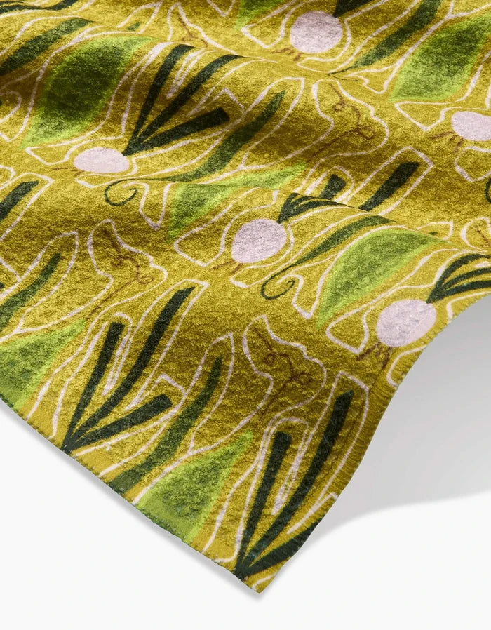 A close-up of Veg on Parade Geoweave fabric by Lizzie Clark shows an abstract pattern with green, white, and pink curved lines and circles—creating a modern design ideal for a stylish bar towel.