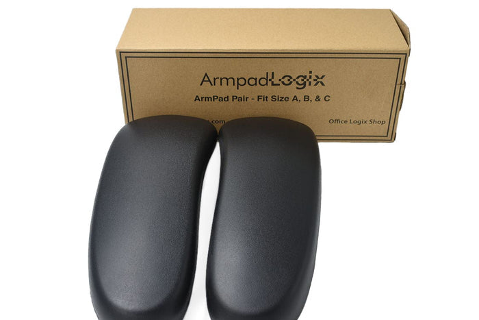Pair of black vinyl office chair arm pads in front of Office Logix Shop box replacement parts