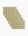 Six Walking Cheetah rectangular placemats by Jasmine Blooms Designs, featuring orange cheetahs on light blue, made from post-consumer recycled materials, are displayed in a fanned-out stack on a white surface.