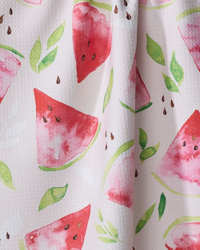 The "Watermelon Slice" fabric by Elena Fay features watercolor watermelon slices, green leaves, and seeds on a light background—perfect for a cheerful recycled kitchen towel.