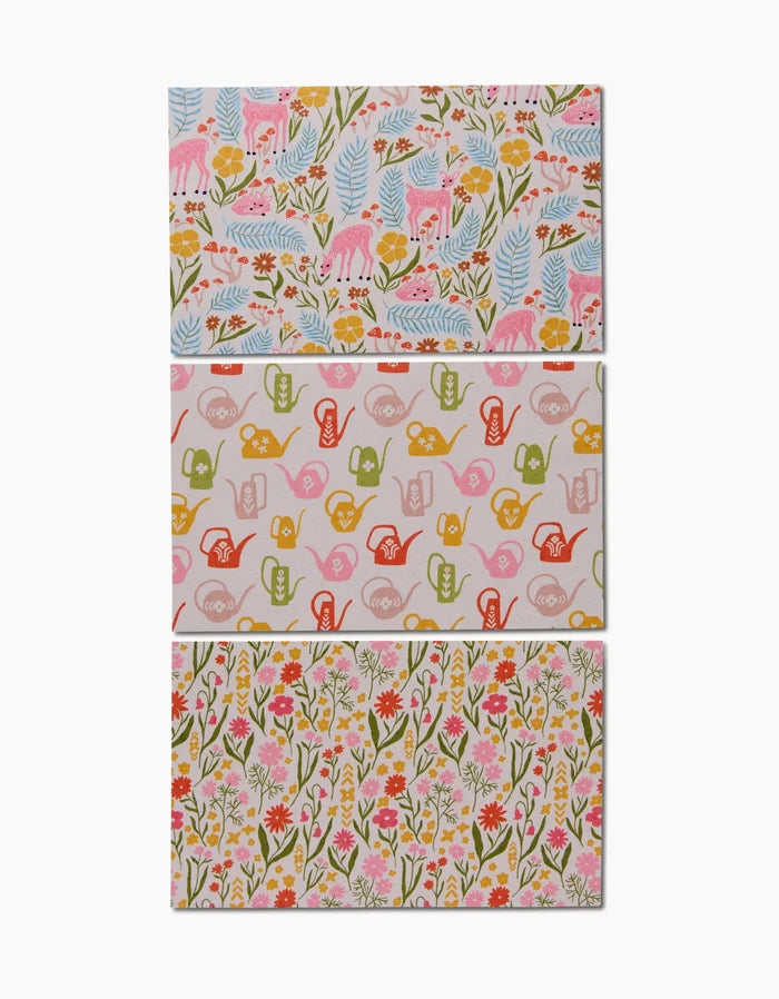 Kayla Anns Whimsy and Retro features three patterned sheets: pink deer with flowers, colorful watering cans, and wildflowers—an eco-friendly alternative to Not Paper Towels.
