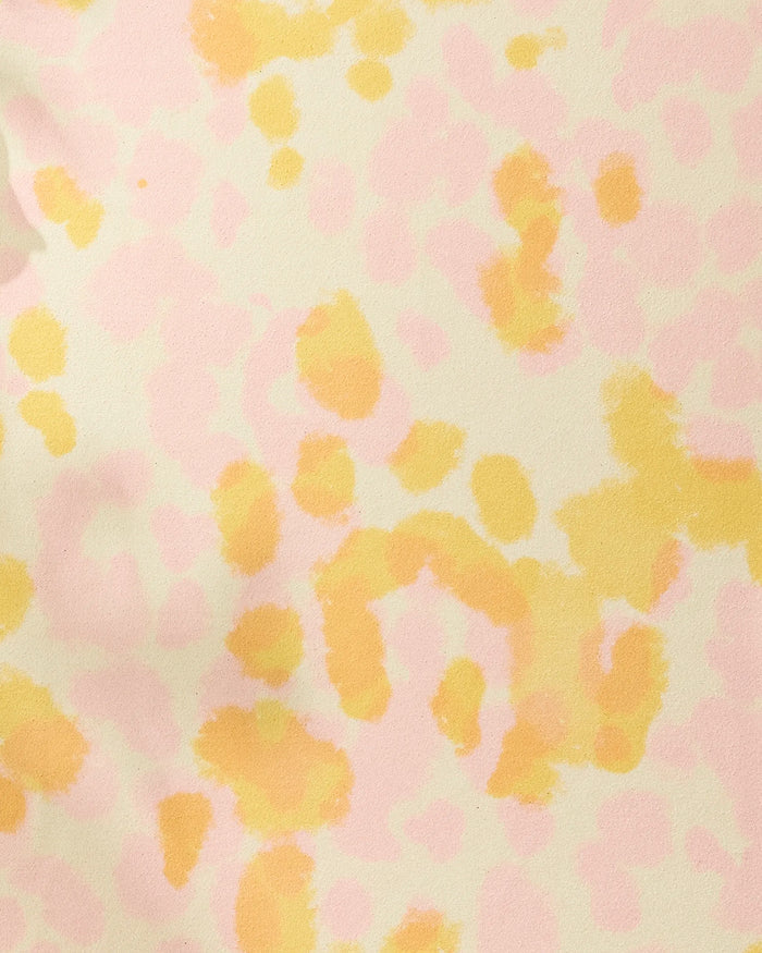 Whimsy by GEOMETRY features an abstract pattern of yellow and light pink spots on off-white, resembling watercolor or animal print—an ideal recycled yoga towel that adds both style and function to your practice.