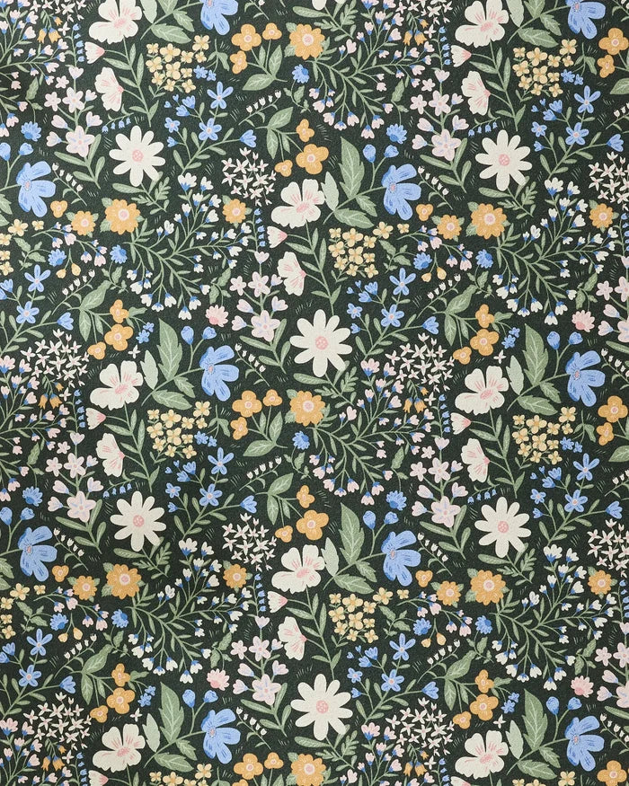 Wildflower Vine Blush by Danelys Sidron features a dense, seamless floral pattern in white, yellow, pink, and blue with green leaves on a dark ground—ideal for adding beauty and grip to your non-slip yoga towel.