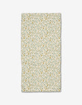 The Wildlight bar towel by Danelys Sidron features a delicate yellow and green floral and leaf pattern on white, crafted from recycled materials.