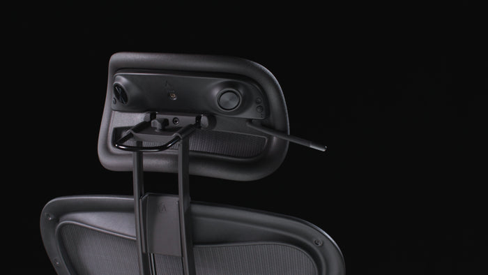 Rear view of the Atlas Aeron Chair Headrest Bluetooth Speaker installed on a Herman Miller Aeron chair