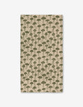 The Woodland Mushroom by Kayla Ann is a beige rectangular cloth with a green dotted mushroom pattern, evenly spaced and made from ultra-absorbent recycled materials.