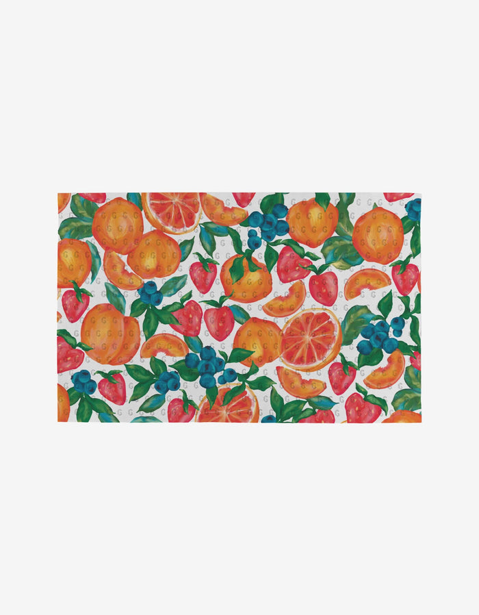 The Zesty Life by Aubrey Fairchild features a vibrant watercolor pattern of oranges, strawberries, blueberries, and grapefruit with green leaves on white. This reusable, eco-friendly design offers a colorful alternative to paper towels.